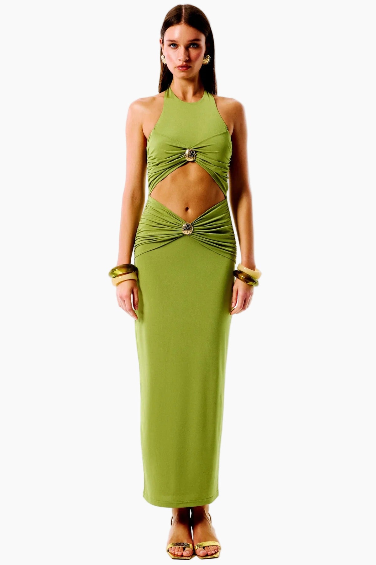 Woman wearing a green evening gown with cut-out design