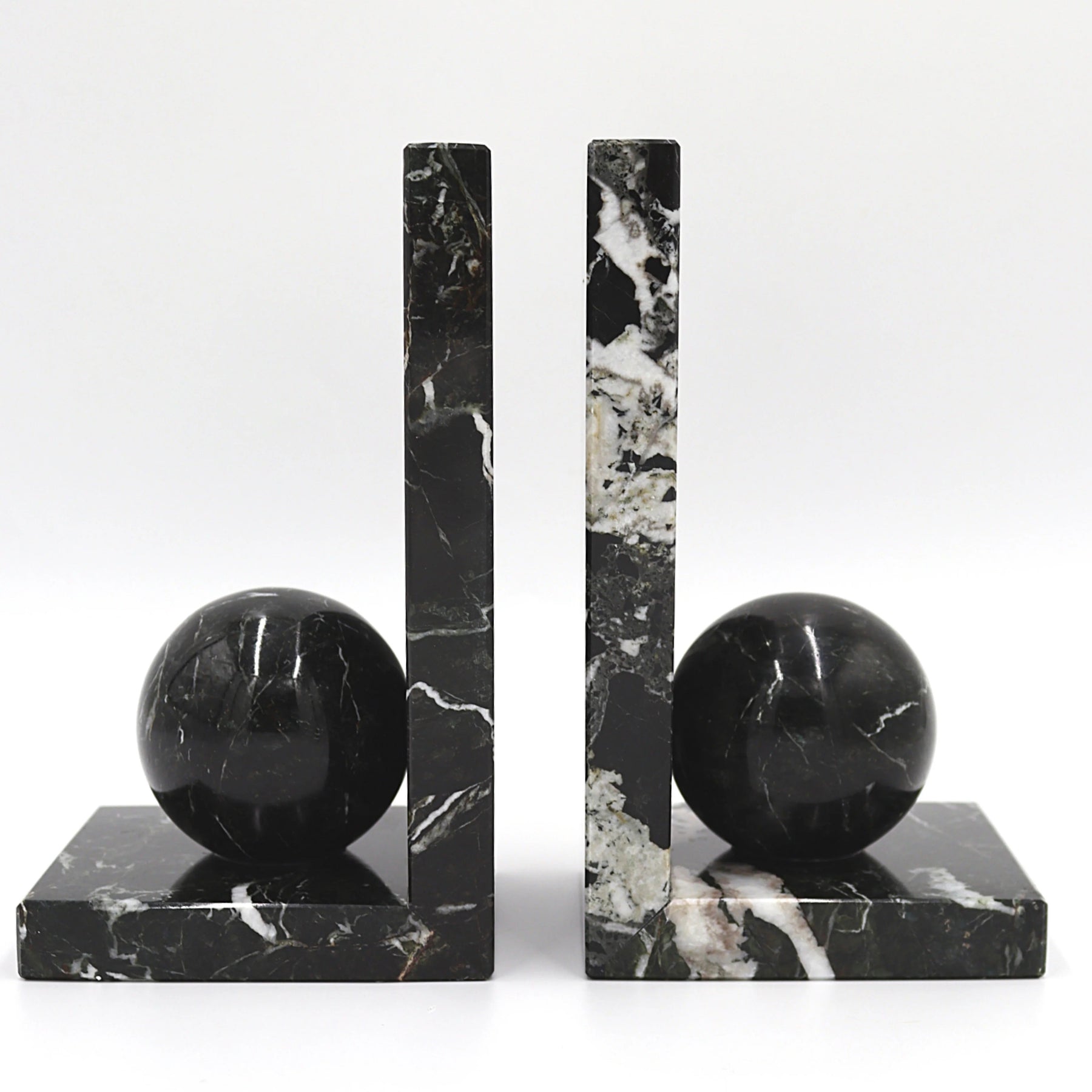 Black marble bookends with spherical ends