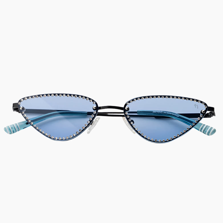 Sunglasses with decorative frame and blue lenses on a white background