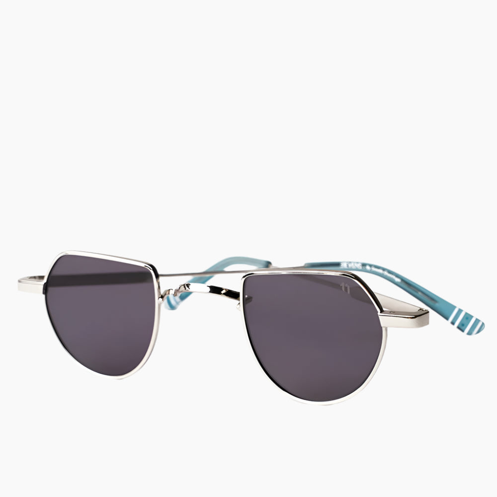 Sunglasses with dark lenses and striped temples