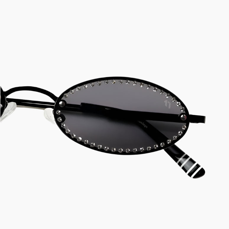 Black sunglasses with decorative elements on a white background
