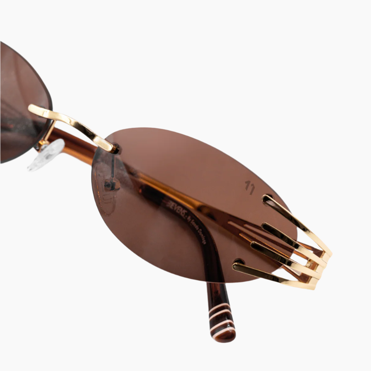 Sunglasses with gold frame and brown lenses