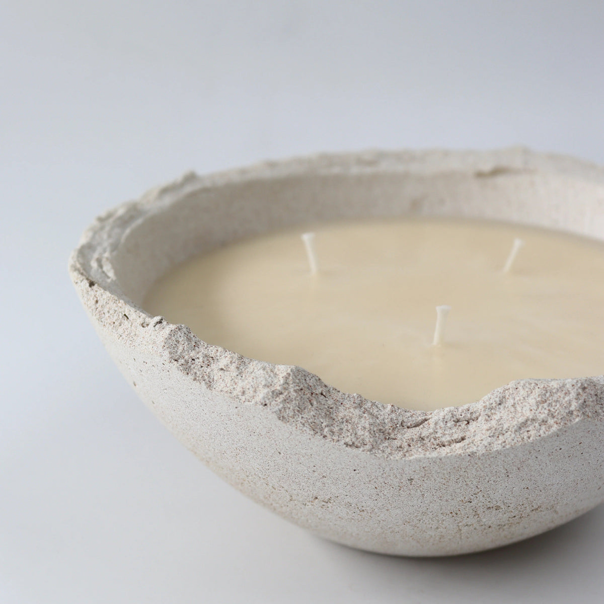 Ceramic bowl with a candle inside
