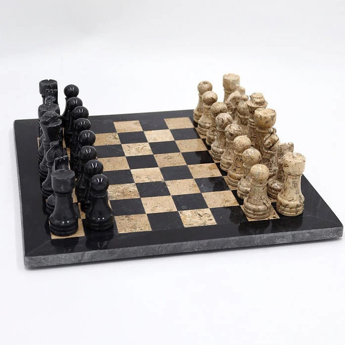 Black and beige chess set on a checkered board with white background