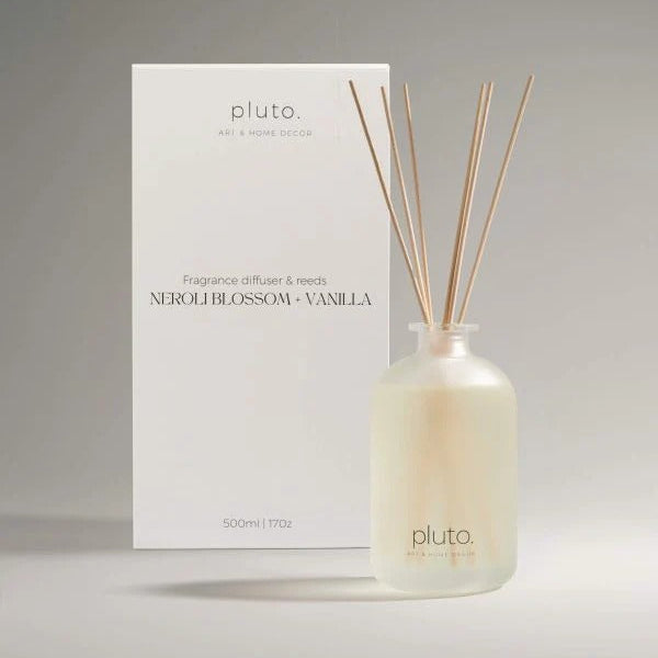 Fragrance diffuser with reeds and packaging labeled 'pluto'