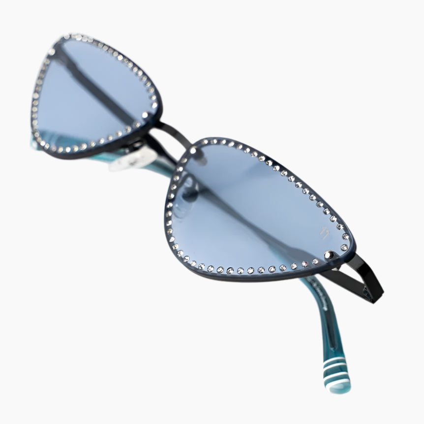 Sunglasses with decorative embellishments on a white background