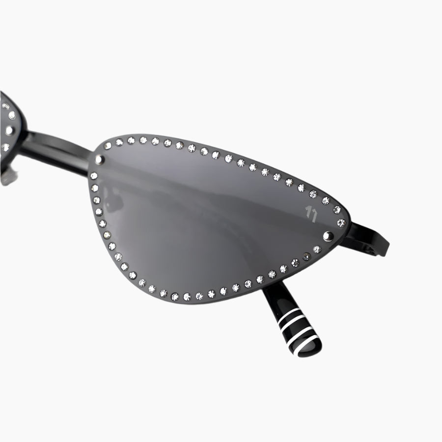 Sunglasses with decorative embellishments on a white background