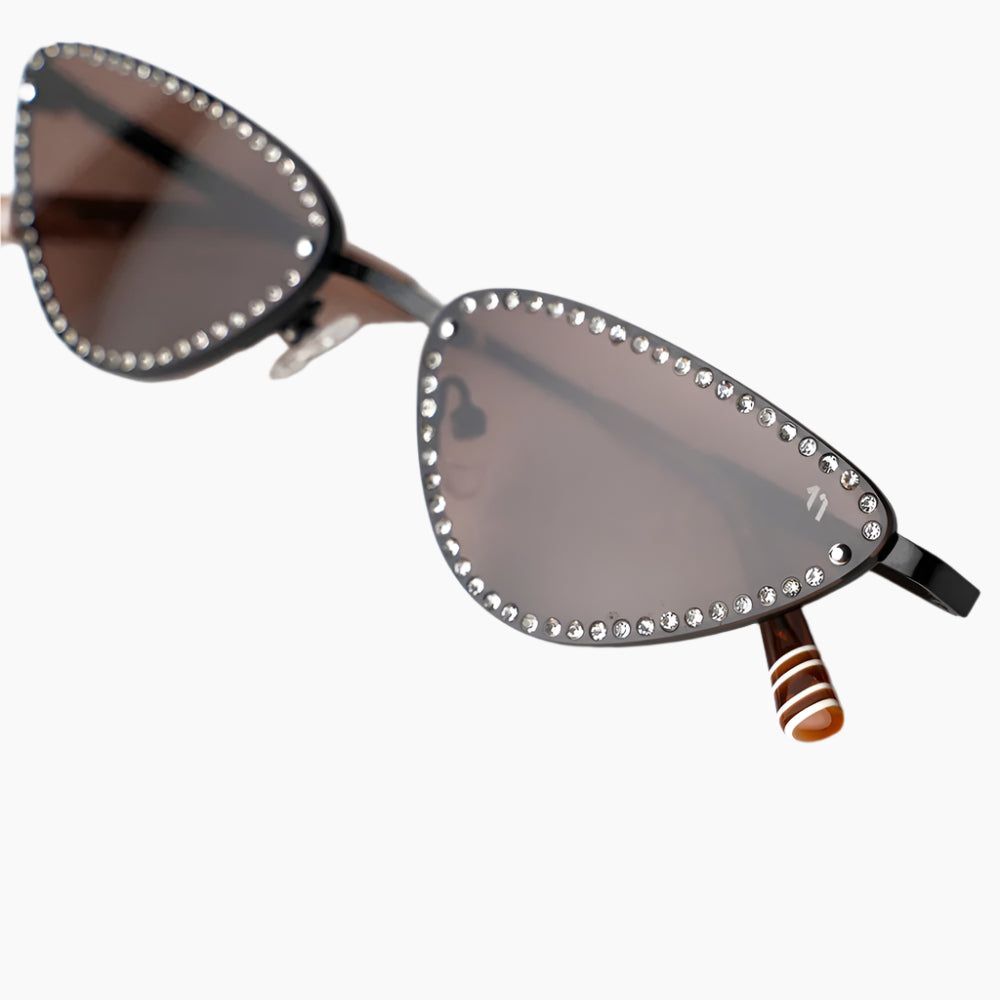 sepia Sunglasses with decorative embellishments on a white background