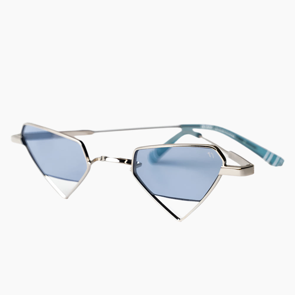 Sunglasses with blue lenses and silver frame on a white background