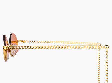 Sunglasses with orange lenses and gold chain
