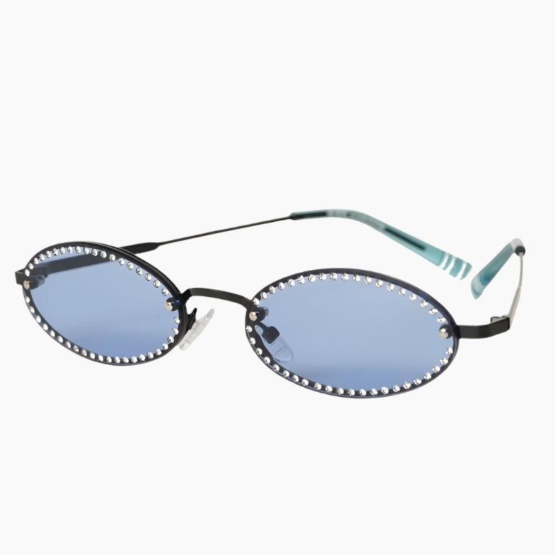 Sunglasses with oval lenses and decorative rim on a white background