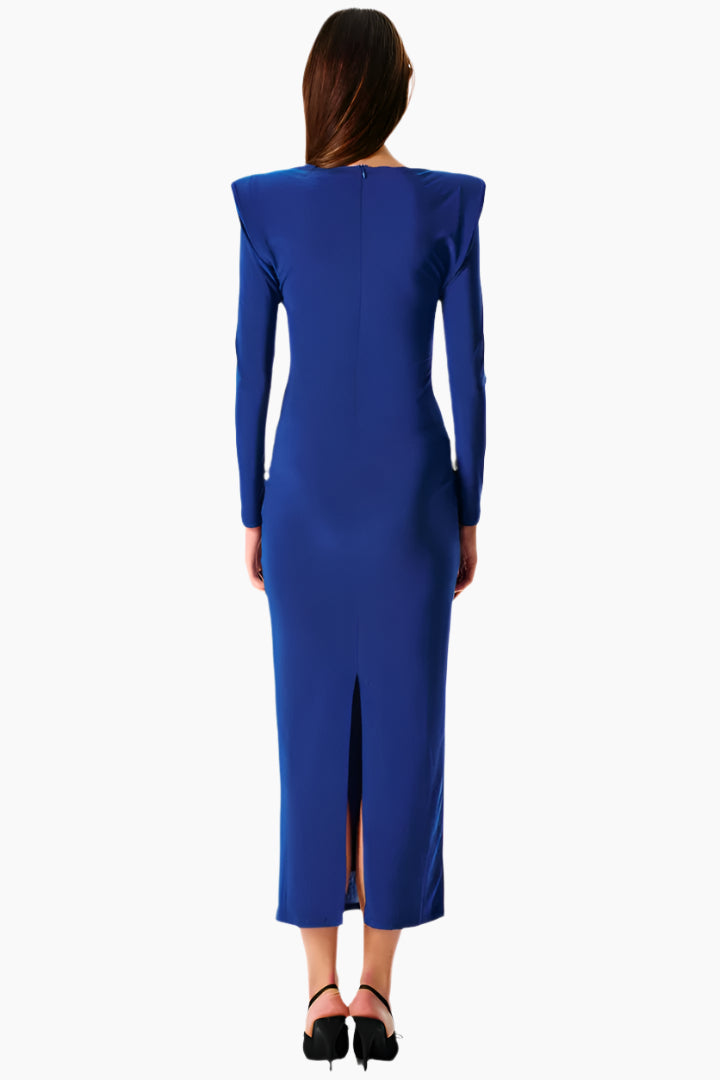 Woman wearing a blue dress with a slit