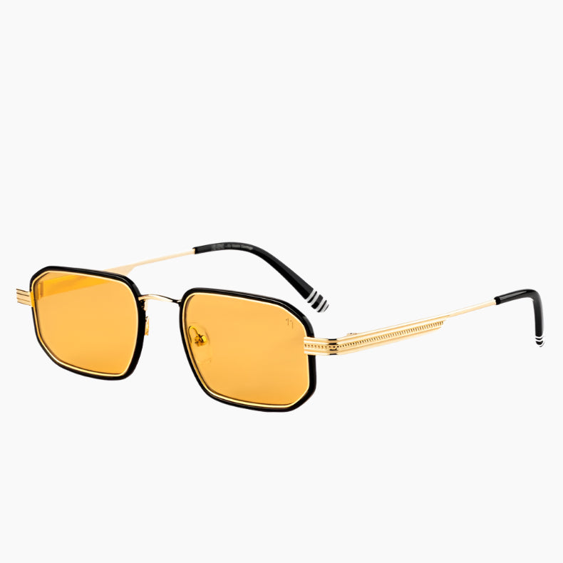 Sunglasses with gold frames and yellow lenses on a white background