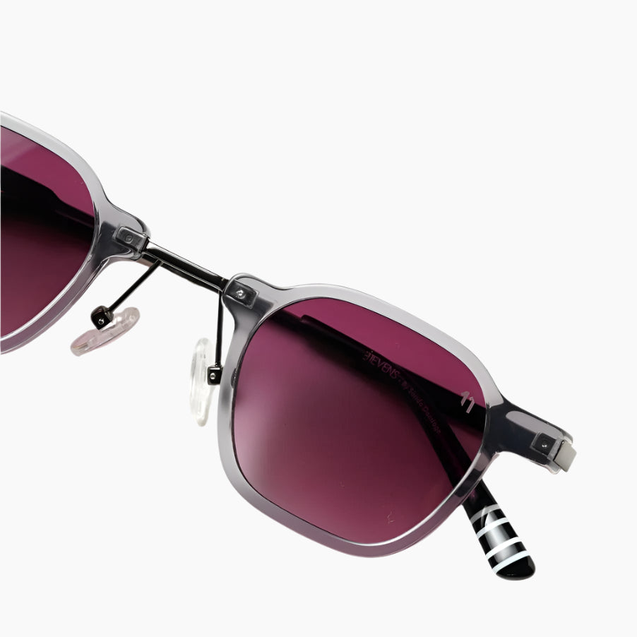 Sunglasses with dark pink lenses and striped arms