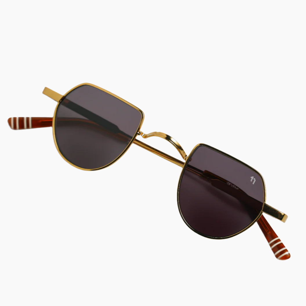 Gold-framed sunglasses with dark lenses