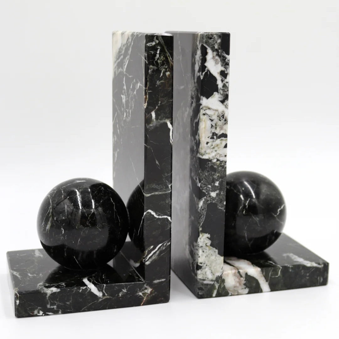 Black marble bookends with spherical ends
