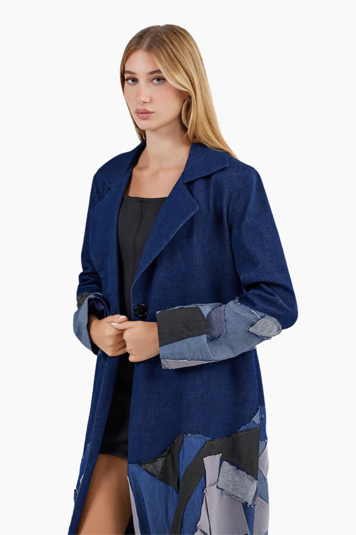 Woman wearing a blue coat with patchwork design