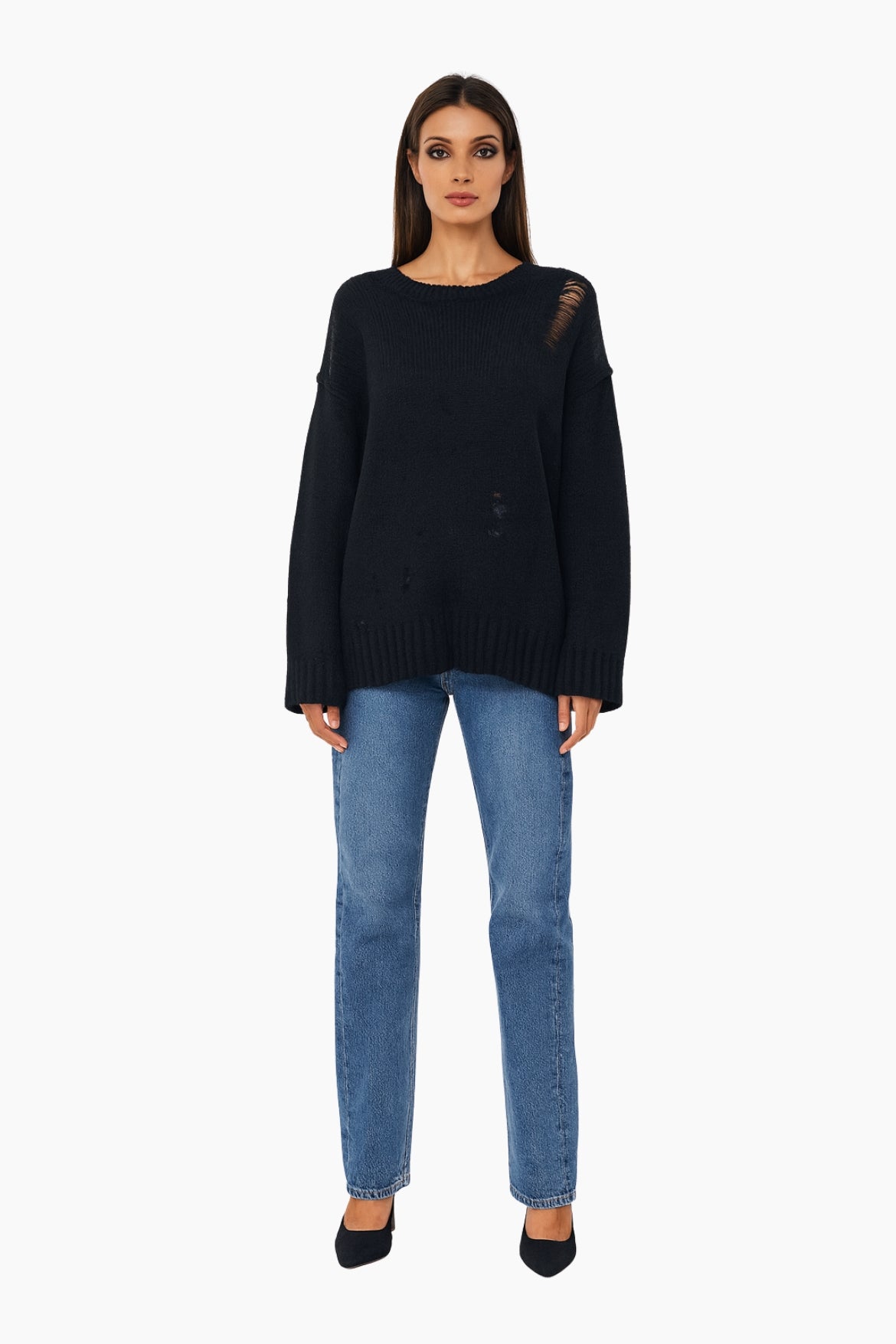 Woman wearing a black sweater and blue jeans