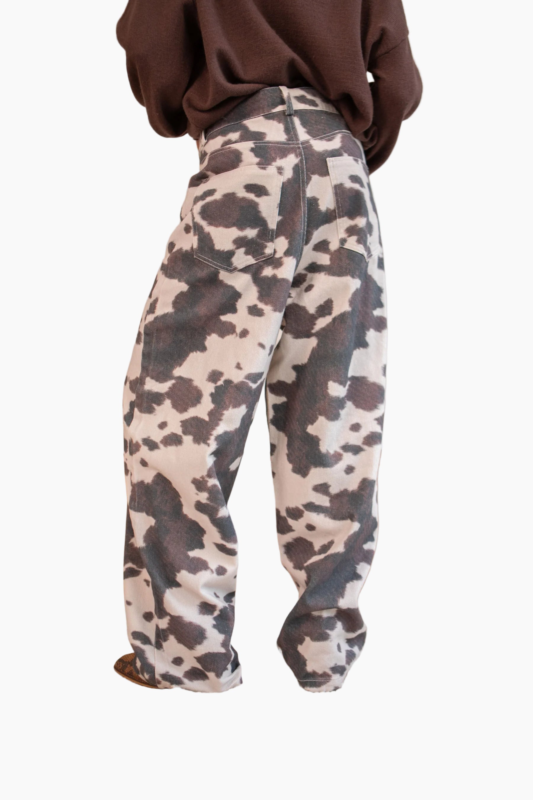 Person wearing camouflage pants in a living room setting