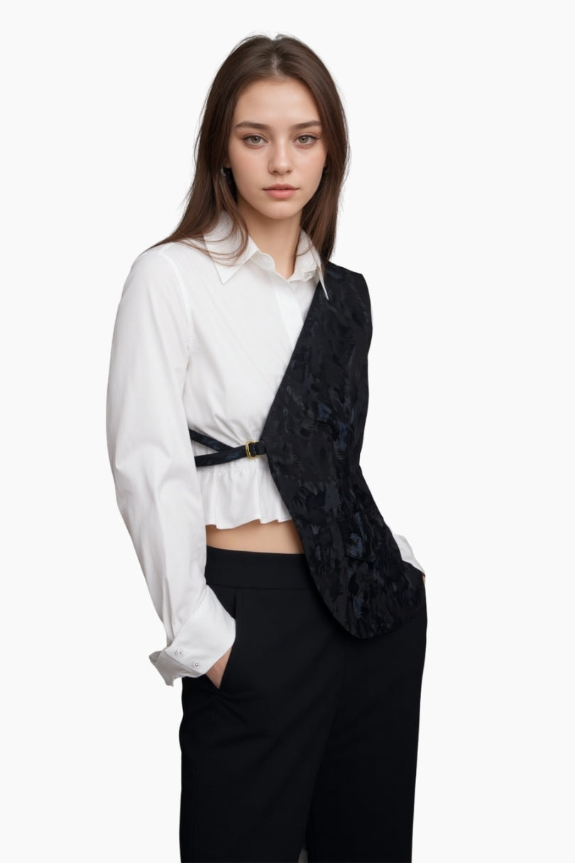 Woman wearing a white blouse and black floral vest