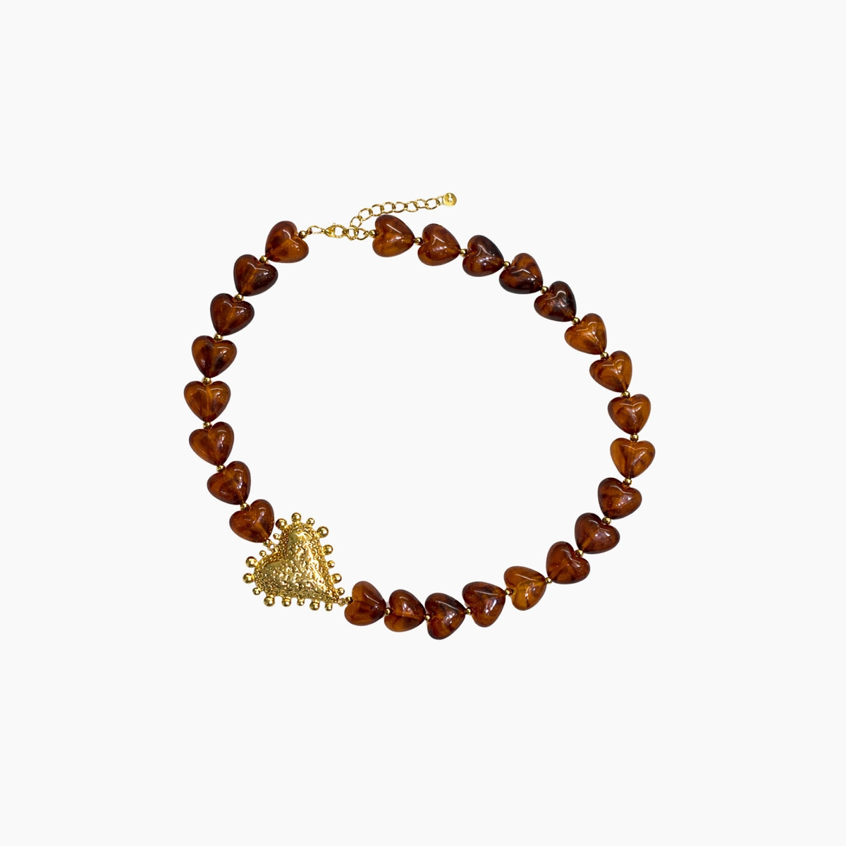 Necklace with heart-shaped brown beads and a gold pendant on a white background