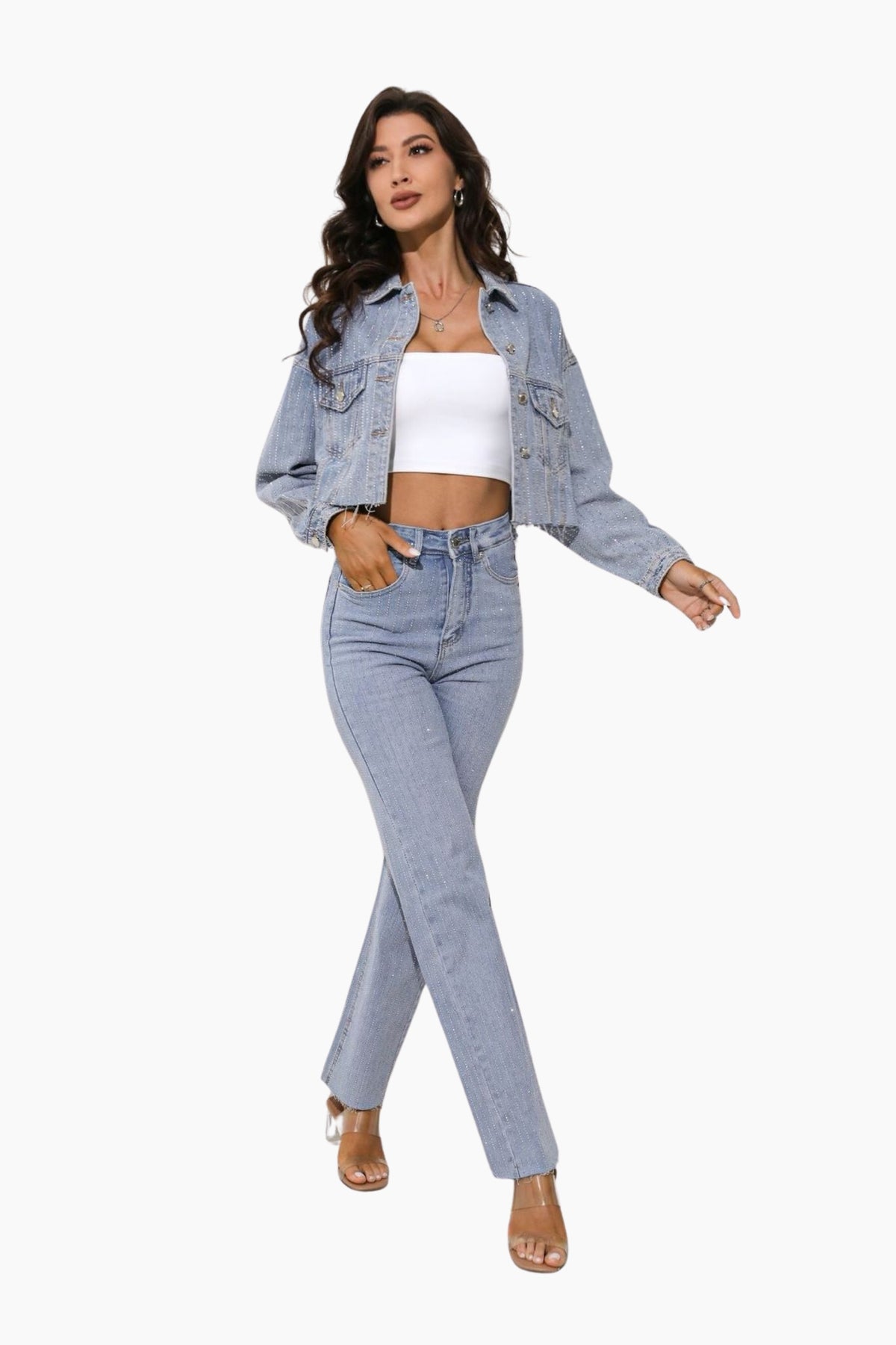 Woman wearing a denim jacket, white top, and blue jeans
