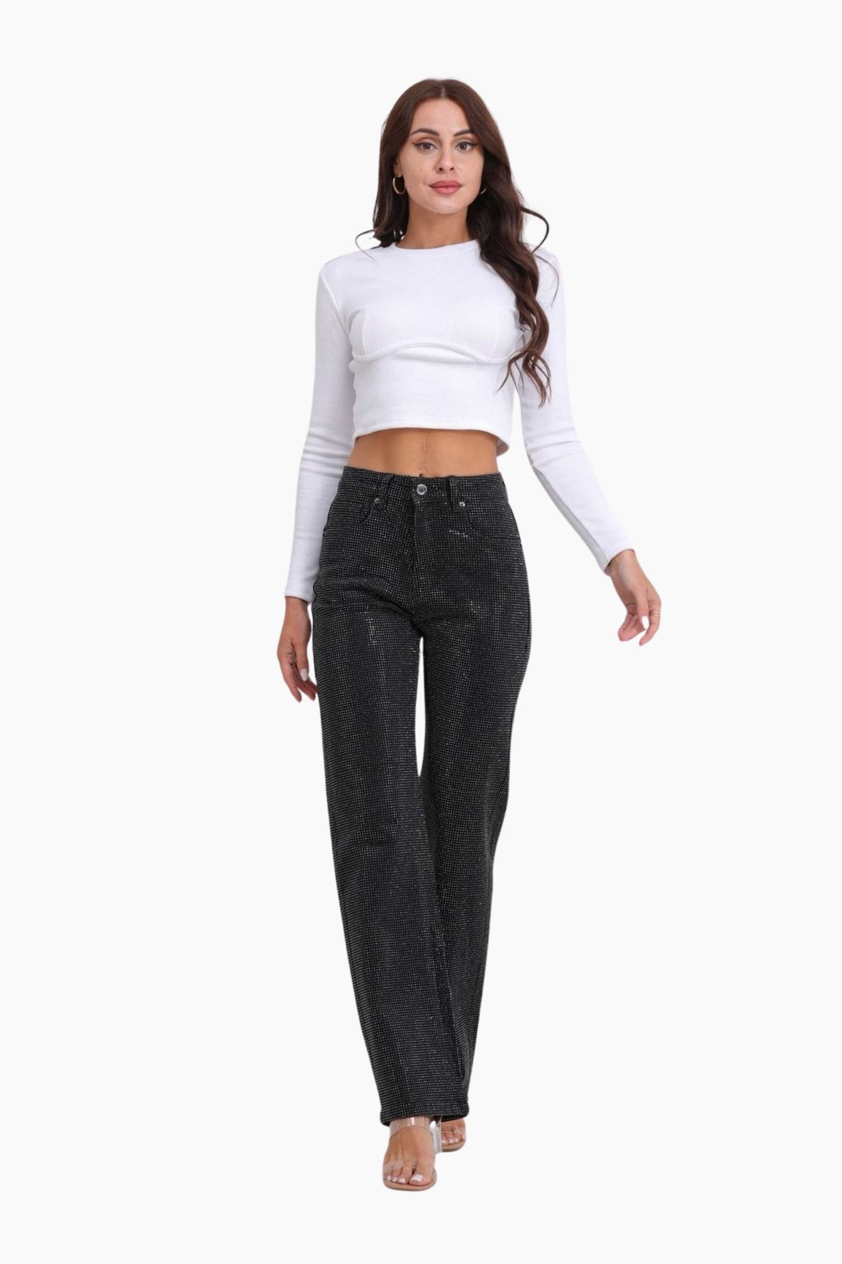 Woman wearing a white long-sleeve top and black jeans