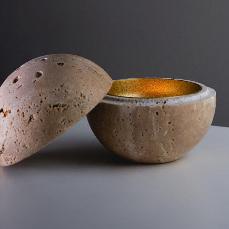 Nix insence burner - FLTRD UAE , A hand-carved circular-shaped incense holder made of beige travertine with nine holes.