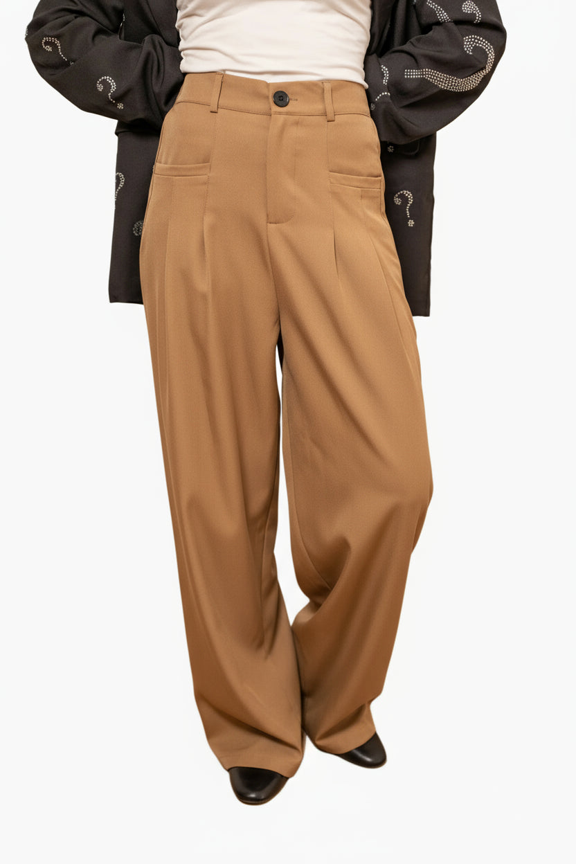 Person wearing Flowing pants with a wide and elegant cut,i brown high-waisted pants .