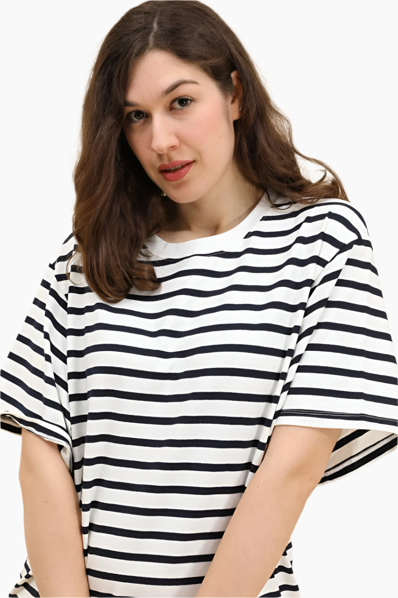 Woman wearing a black and white striped shirt