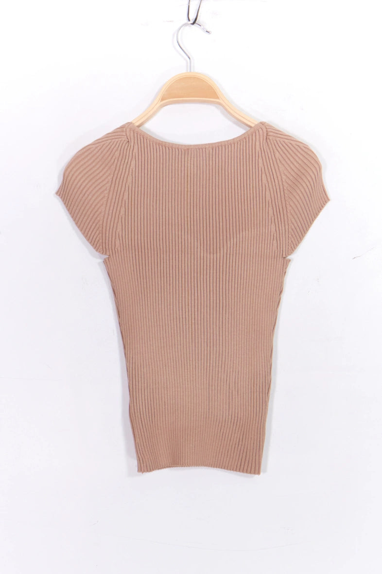 pink ribbed knit top on a wooden hanger