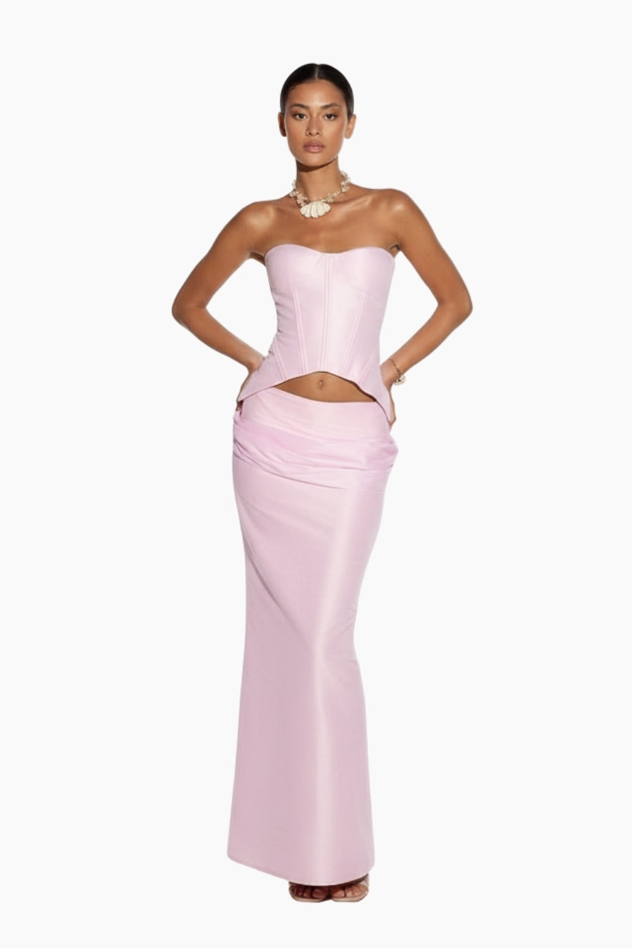 Woman wearing a Pink strapless corset and skirt