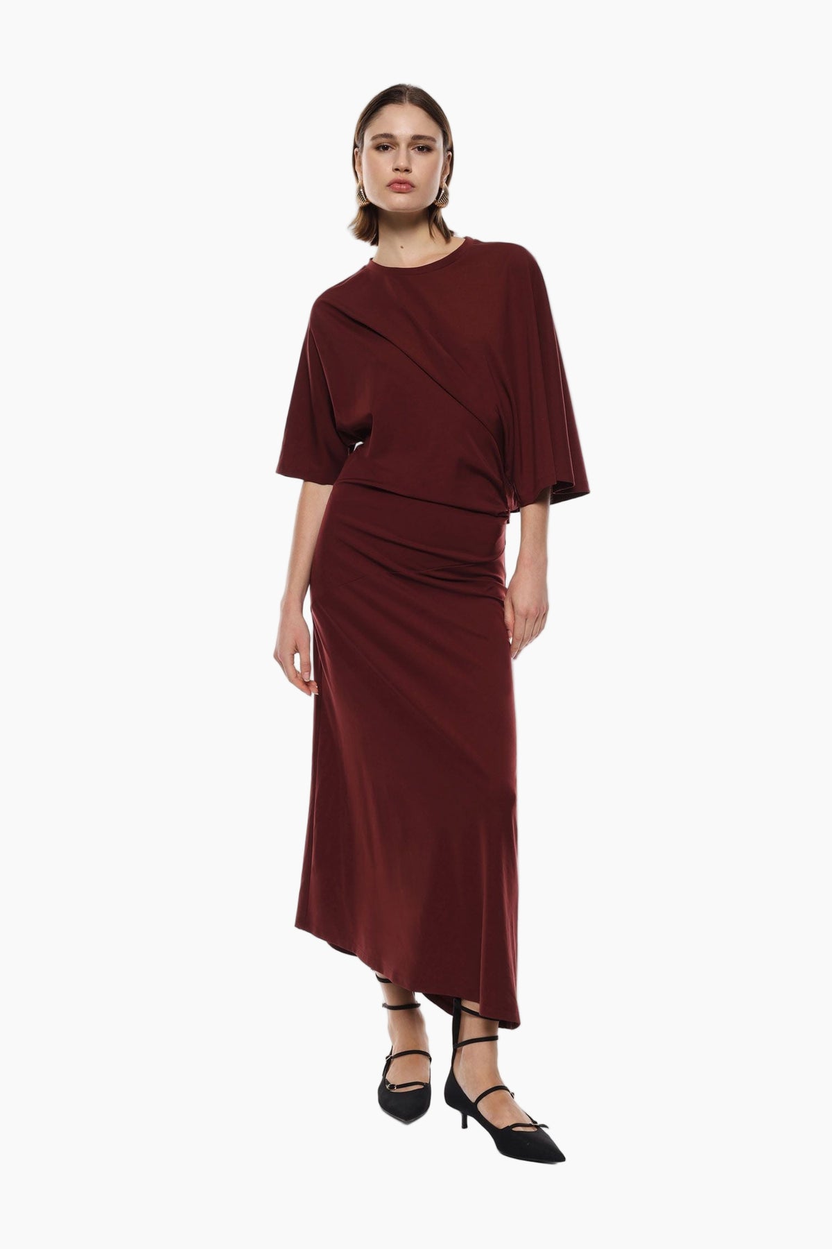Woman wearing a burgundy outfit