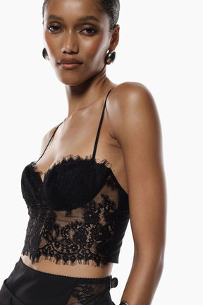 Woman wearing a black lace top 