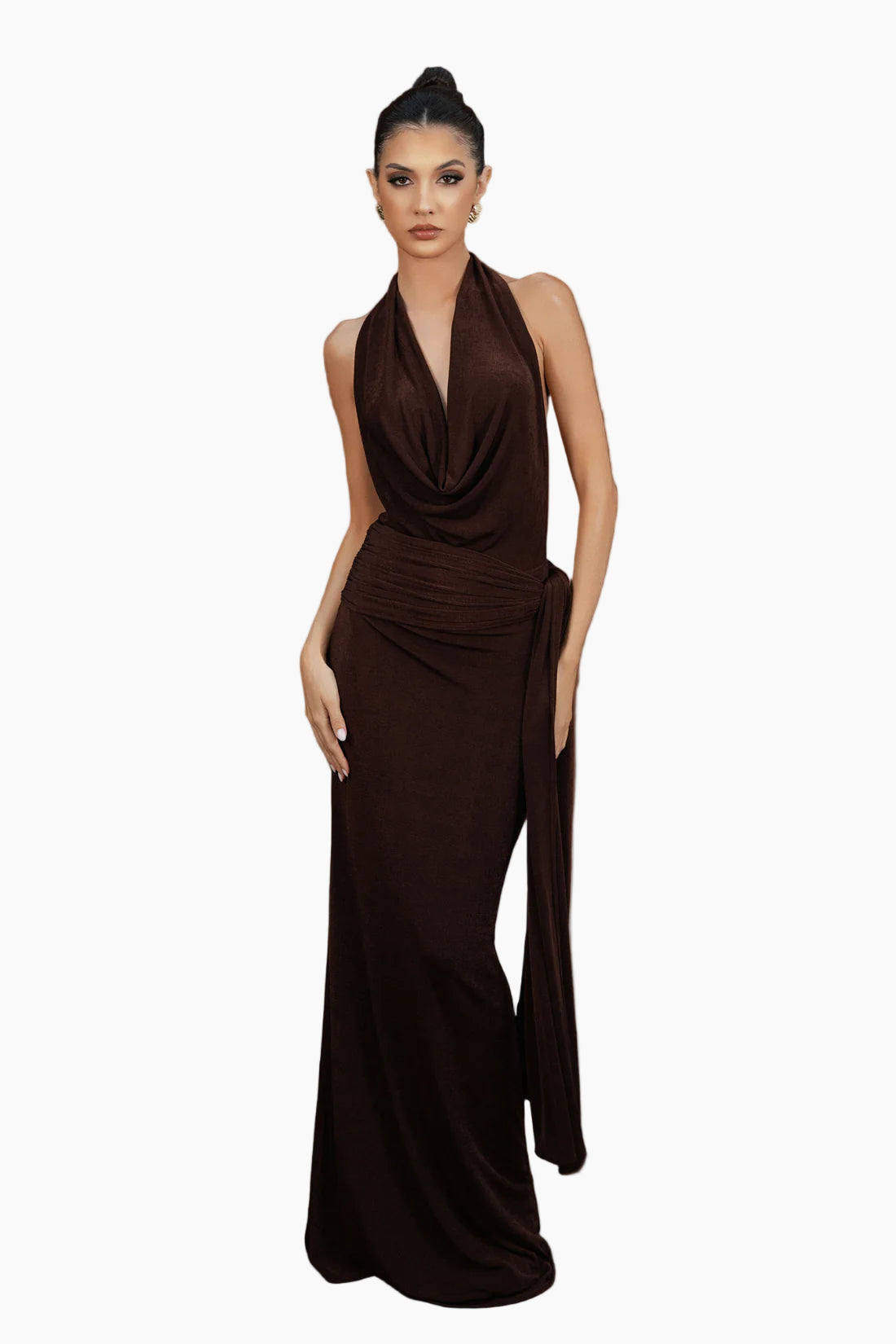 Woman wearing a brown halter neck dress on a white background