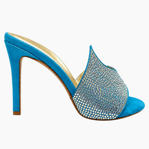 A single high-heeled mule shoe in bright blue suede, featuring a pointed toe embellished with rows of clear rhinestones and a slim high heel, shown against a plain white background.
