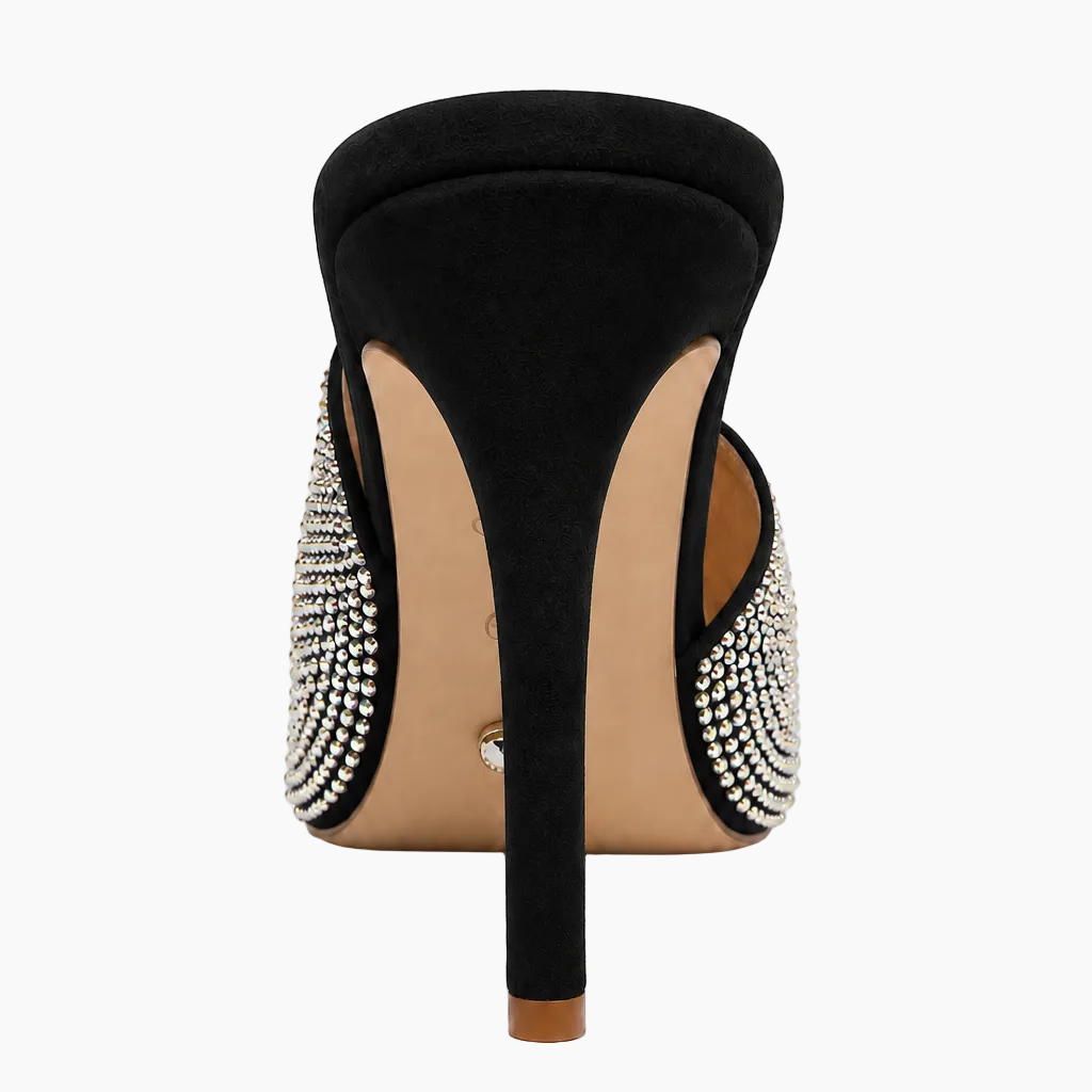 A single black stiletto pump with a high heel and a row of sparkling silver rhinestones along the sides, shown from a rear three-quarter view on a white background.
