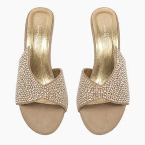 A pair of women's slide sandals with metallic gold insoles and straps heavily embellished with small clear rhinestones, shown from a top-down view on a white background.