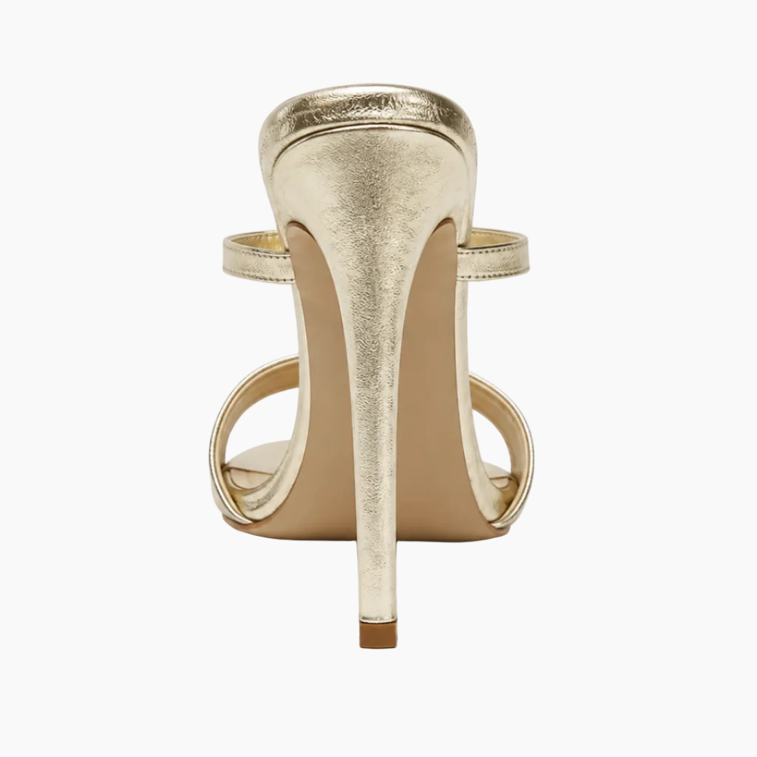 A single metallic gold stiletto sandal shown from a rear three-quarter view on a clean white background.