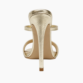 A single metallic gold stiletto sandal shown from a rear three-quarter view on a clean white background.