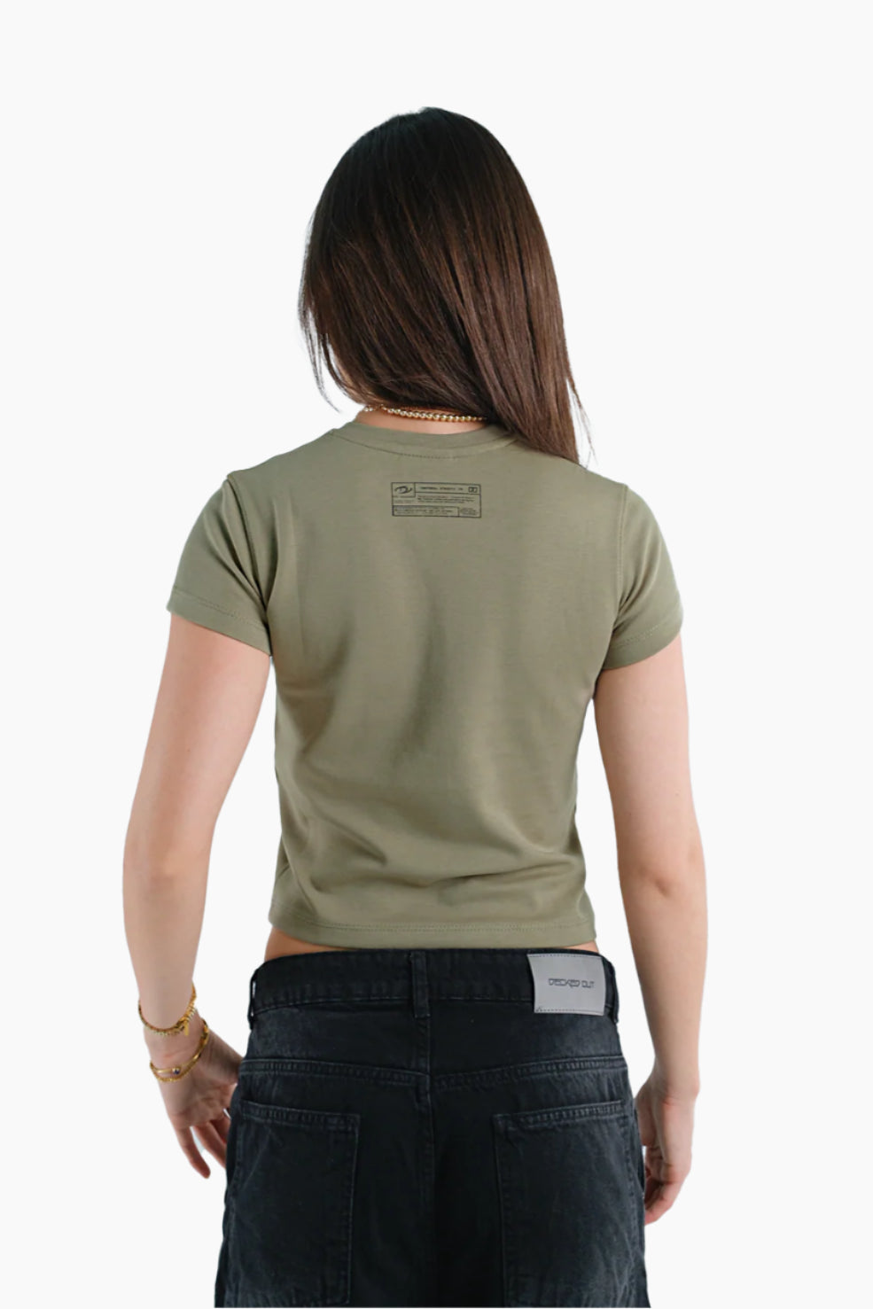 Person wearing a green t-shirt with text on the back