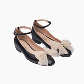 Black shoes with beige bow details 