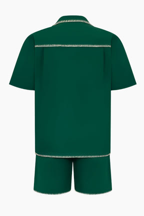 Green outfit with white trim 