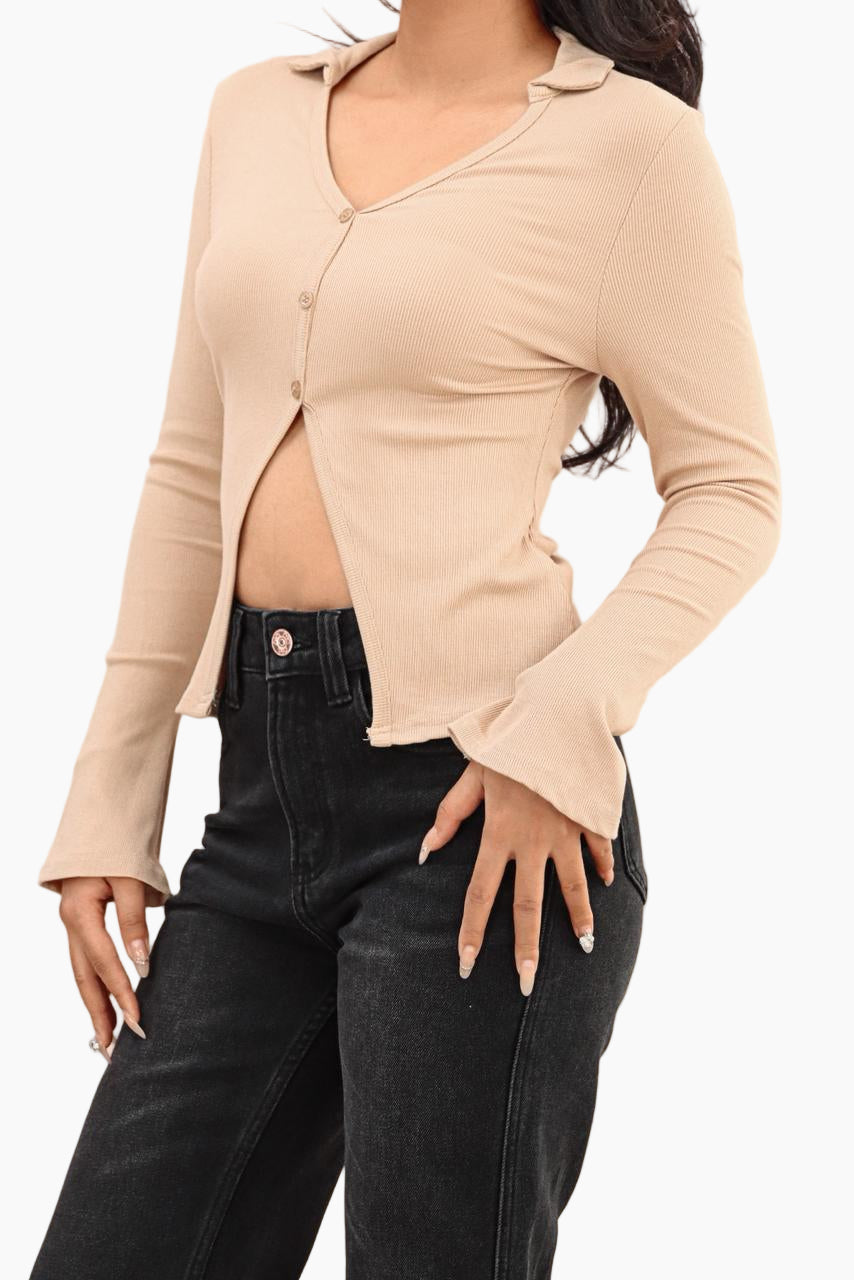 Beige long-sleeve top worn by a person 
