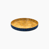 Round wooden tray with blue rim on a white background