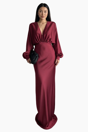 Woman wearing a burgundy evening gown 