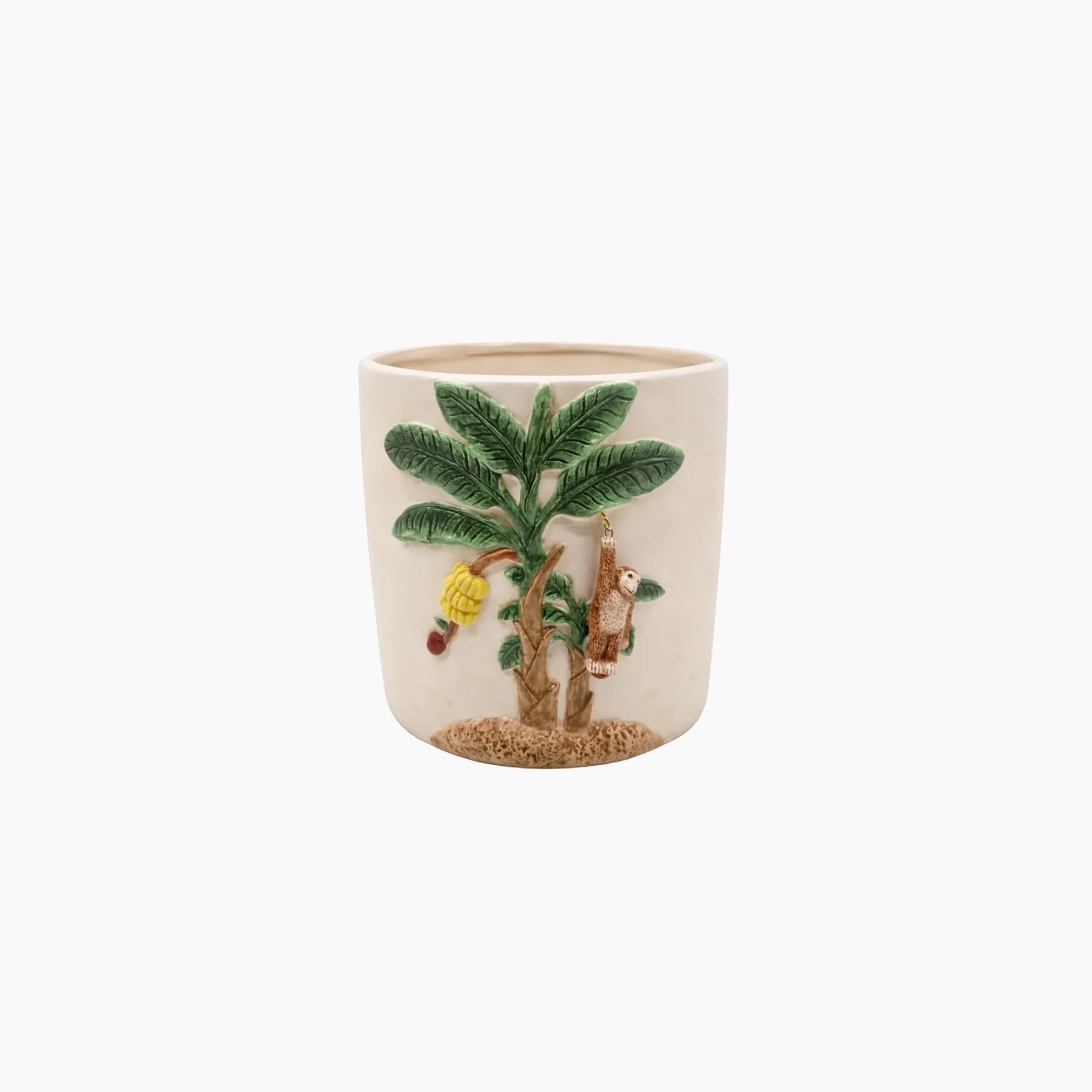 Ceramic cup with a palm tree and monkey design on a white background