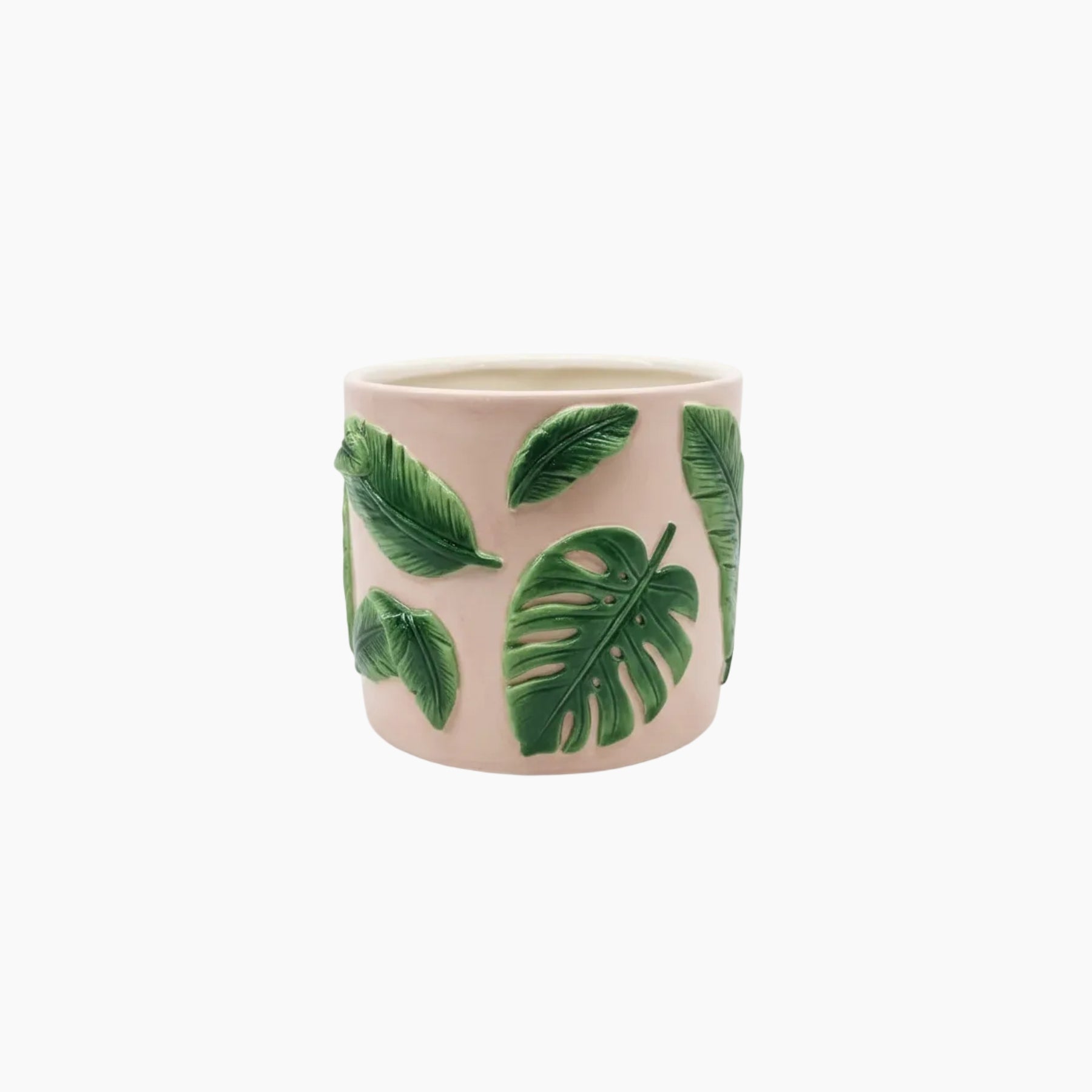 Ceramic mug with green leaf patterns on a white background