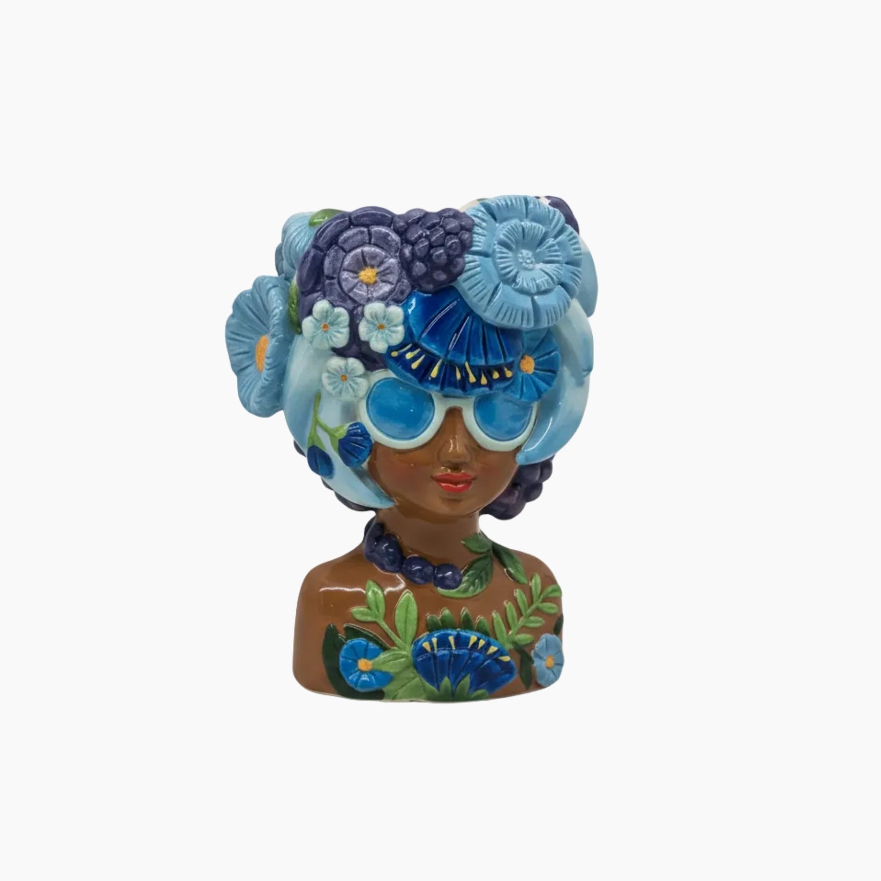 Decorative figurine of a woman with a floral headpiece and sunglasses on a white background