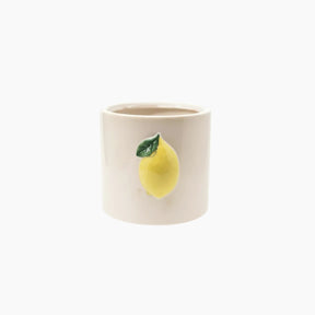 Ceramic mug with a lemon design on a white background